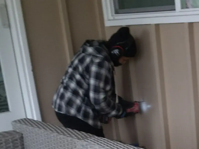 Professional electrician installing an exterior outlet in Darien